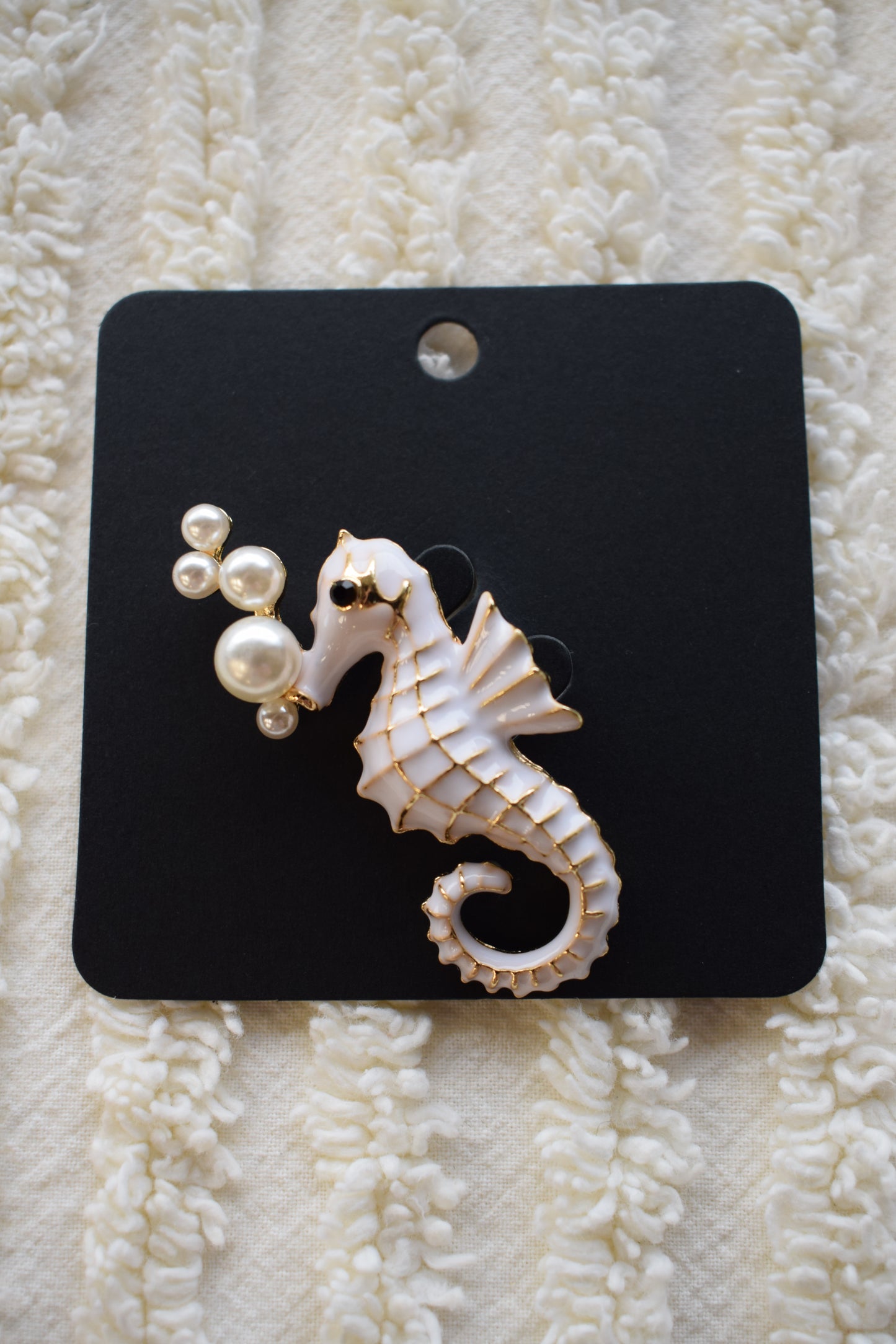 white seahorse brooch